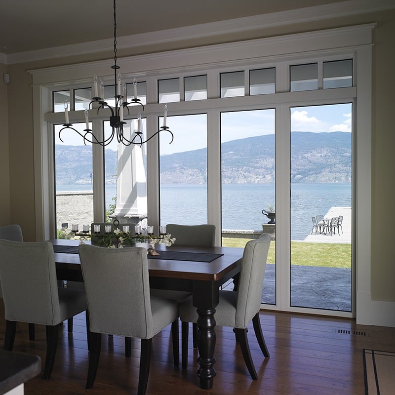 White-trimmed windows in the bright sun.