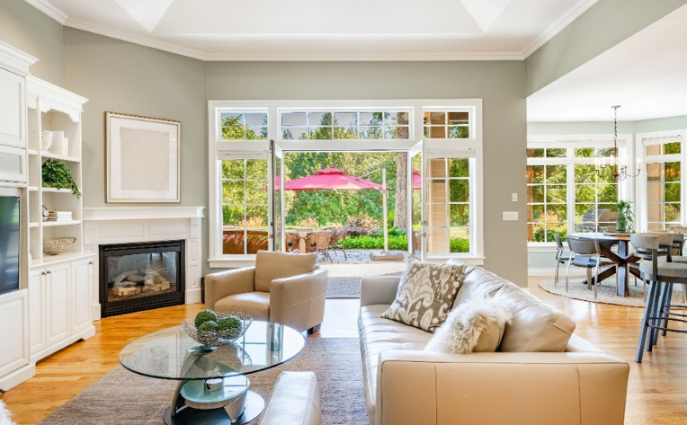 Sunroom interior with a sofa and chairs